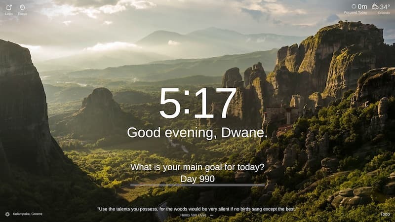 A scenic vista with a dramatic landscape of towering rock formations in a valley. The sky is a gradient of blue and orange with hints of pink from the setting sun. The rock formations rise high in the sky, with the valley floor disappearing in the distance. There are a few trees scattered in the valley. This is a view of the Meteora in Kalampaka, Greece.
