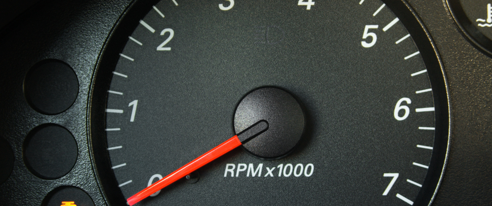 Check engine warning light on a vehicle's dashboard symbolizing the importance of debugging skills for JavaScript interview preparation