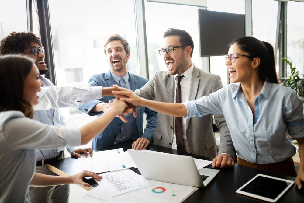 A photo of happy employees working together