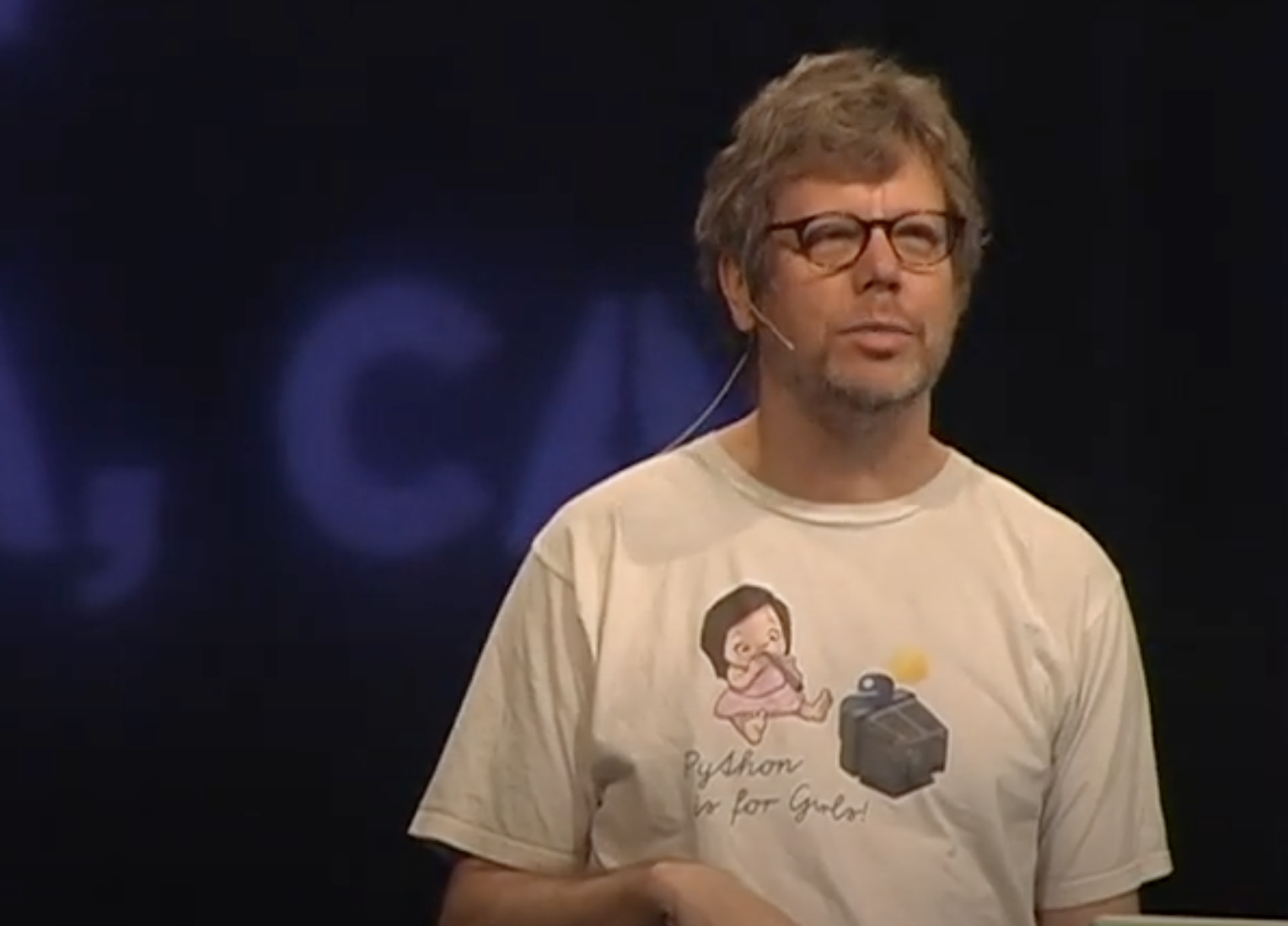 Guido Van Rossum wearing a shirt that says python is for girls