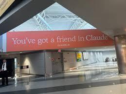 Billboard that says Claude is a friend