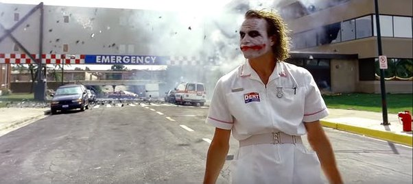 Joker walking away from exploding hospital