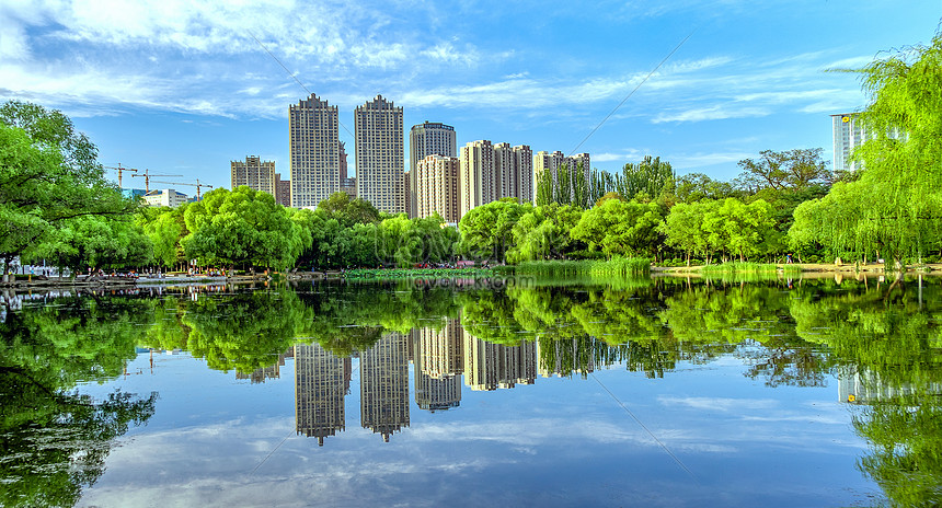 A green city with beautiful gardens and lakes