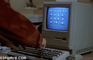 Old Computer with hands typing