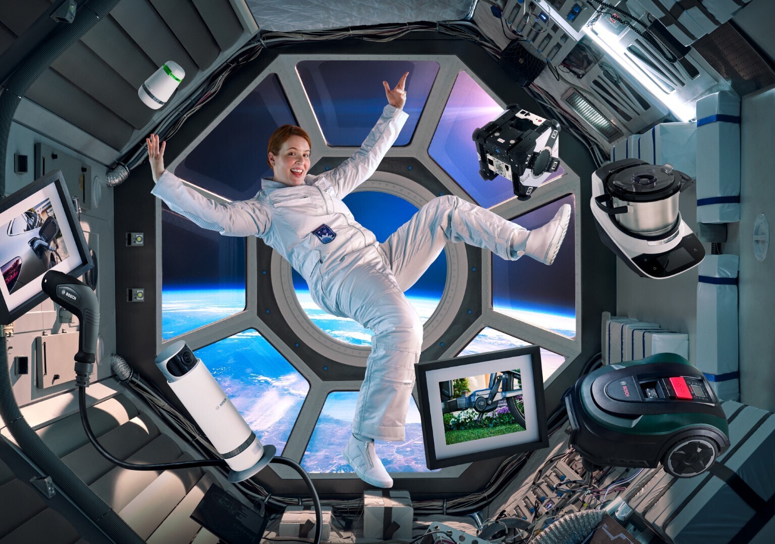 An astronaut in a space station surrounded by Bosch products