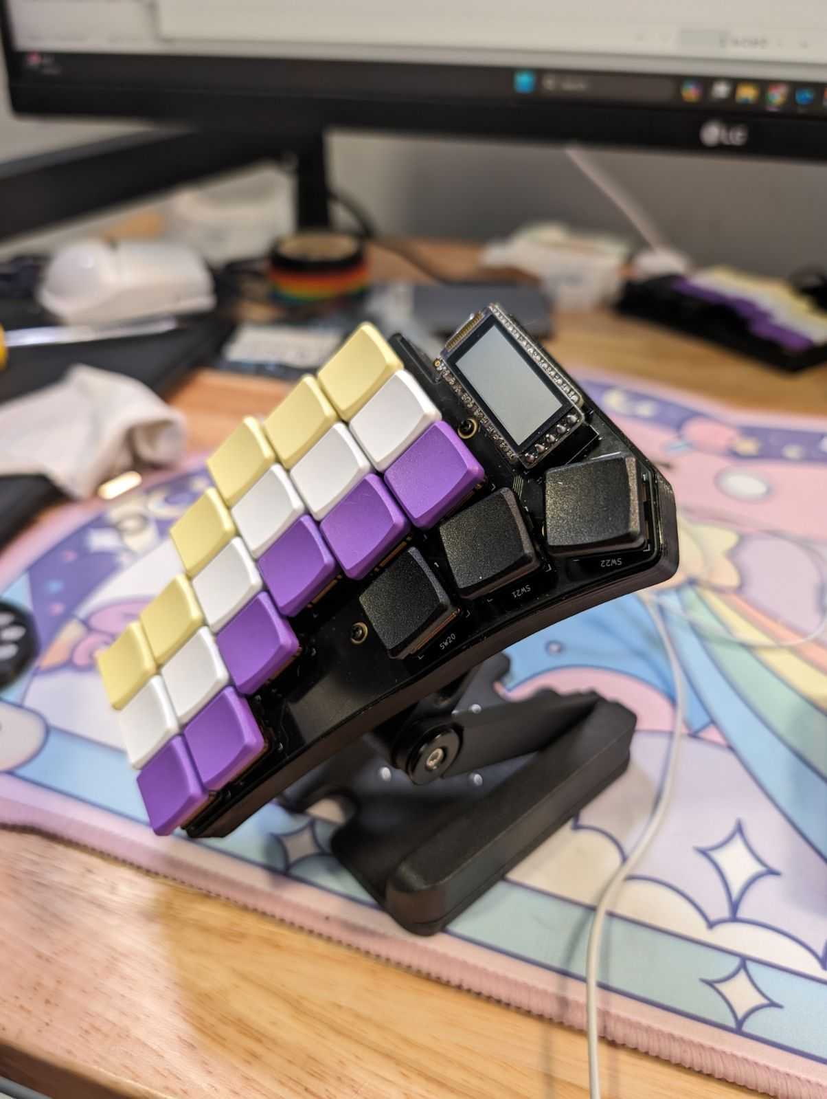 purple and white mechanical keyboard with very few keys