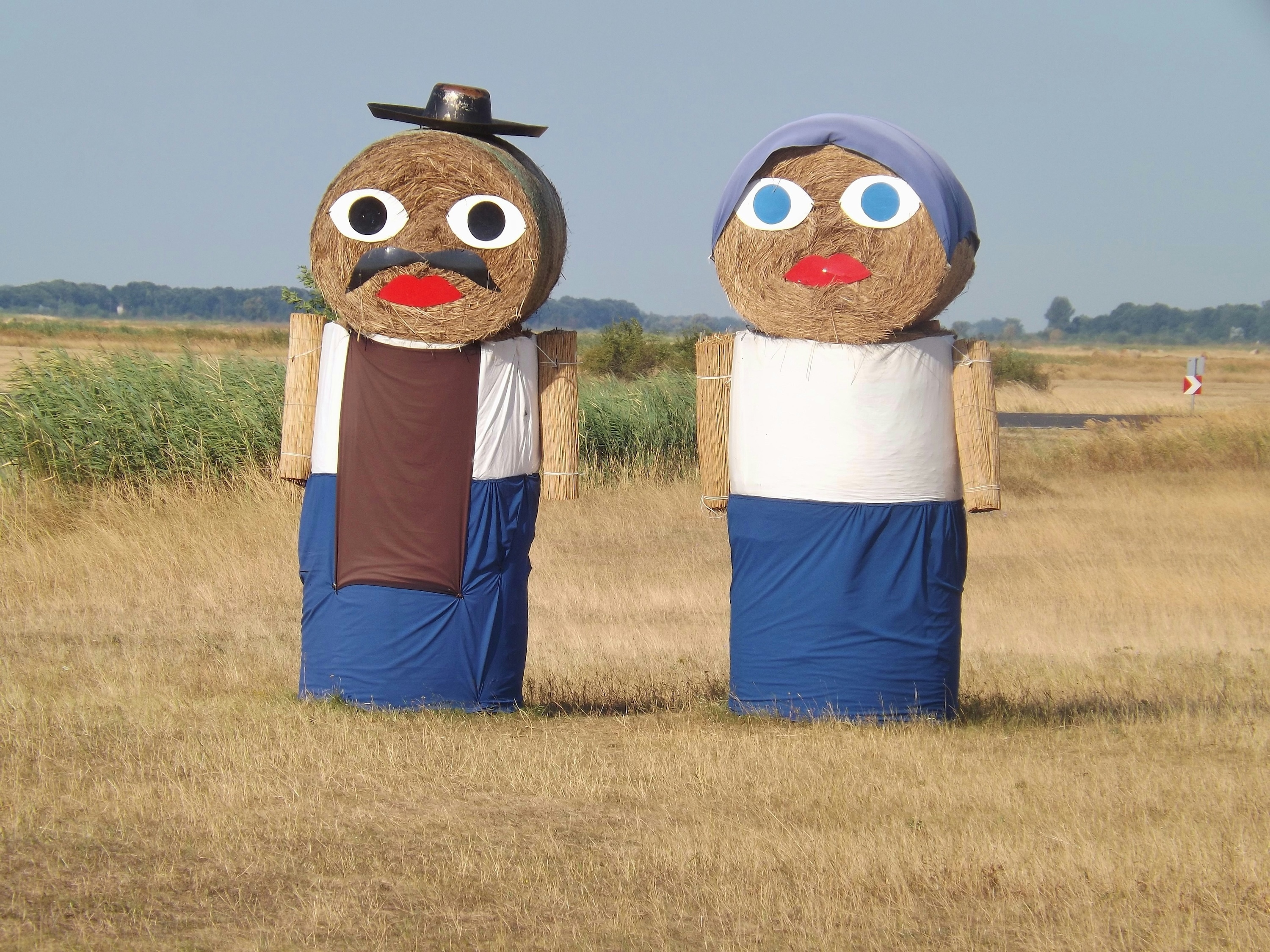 Two Hay bales dressed up to look like a couple