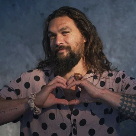 Aquaman shows love with hands