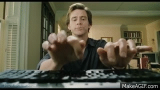 Bruce from Almighty typing on a keyboard