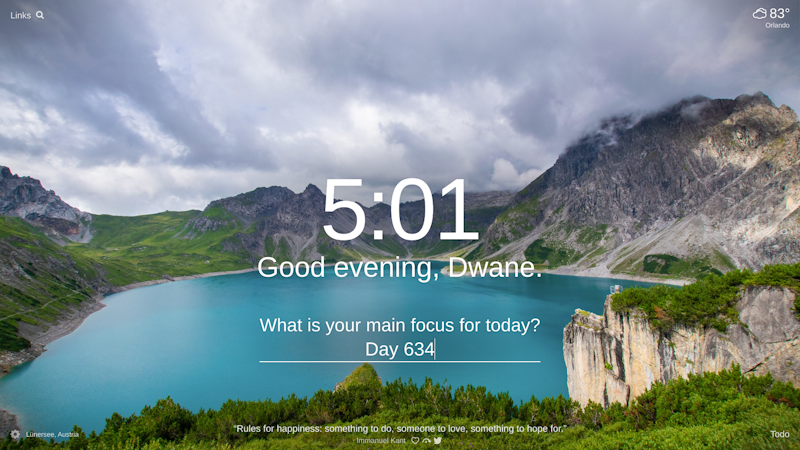A lake surrounded by sky covered mountains and green valleys in Lünersee, Austria